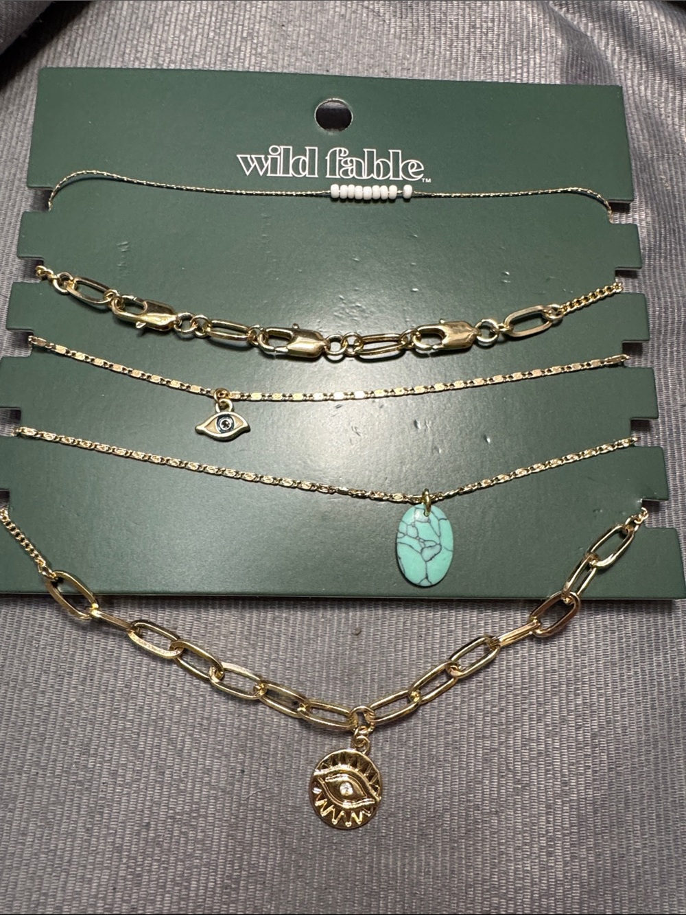 wild fable Gold Tone Layered Necklace Set with Turquoise Stone and Eye Charms